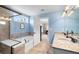 Bright bathroom features double sinks with granite countertop, soaking tub, and glass-enclosed shower at 496 Spring View Dr, Woodstock, GA 30188