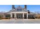 Exterior view of clubhouse and parking lot at 496 Spring View Dr, Woodstock, GA 30188