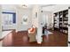 Inviting foyer with hardwood floors, bench seating, and an office view at 496 Spring View Dr, Woodstock, GA 30188