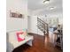 Inviting foyer with bench seating and views into the living room and staircase at 496 Spring View Dr, Woodstock, GA 30188