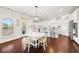 Bright eat-in kitchen with lots of natural light, white cabinets, stainless appliances and an open design at 496 Spring View Dr, Woodstock, GA 30188