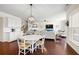 Open concept living area combines kitchen, dining, and Gathering rooms, creating a spacious and inviting atmosphere with hardwood floors at 496 Spring View Dr, Woodstock, GA 30188