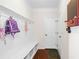 Well-organized mud room with built-in bench, storage cubbies, hooks, and easy access to a door at 496 Spring View Dr, Woodstock, GA 30188