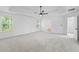 Light-filled main bedroom with large windows and tray ceiling at 6895 Smoke Ridge Dr, Atlanta, GA 30349