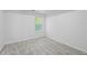 Bedroom with neutral gray carpet, a window, and neutral walls creates a flexible space at 6895 Smoke Ridge Dr, Atlanta, GA 30349