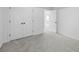 Bedroom view showcases a closet with white doors and a view of another room through an open doorway at 6895 Smoke Ridge Dr, Atlanta, GA 30349