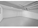 Expansive garage featuring durable sealed concrete floors and ample open space for vehicles and storage at 6895 Smoke Ridge Dr, Atlanta, GA 30349