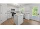 Stylish kitchen showcasing granite countertops, stainless steel appliances, and island at 6895 Smoke Ridge Dr, Atlanta, GA 30349