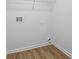 Functional laundry room features vinyl floors, washer hookups and dryer vents, ready for appliance installation at 6895 Smoke Ridge Dr, Atlanta, GA 30349