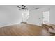 Open concept living room showcasing wood flooring and access to various rooms at 6895 Smoke Ridge Dr, Atlanta, GA 30349