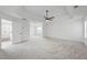 Spacious main bedroom with tray ceiling leading to the main bath and closet at 6895 Smoke Ridge Dr, Atlanta, GA 30349