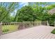 Back deck overlooking lush green backyard with wooded area at 1000 Grimes Bridge Rd, Roswell, GA 30075