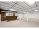 Large finished basement featuring a bar area, offering ample space for entertaining and recreation at 1000 Grimes Bridge Rd, Roswell, GA 30075