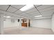 Large open finished basement with carpet flooring and support columns at 1000 Grimes Bridge Rd, Roswell, GA 30075