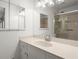 Bright bathroom with granite counters, neutral walls and shower with glass door at 1000 Grimes Bridge Rd, Roswell, GA 30075