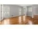 Bright bedroom featuring hardwood floors, white shutters and neutral walls at 1000 Grimes Bridge Rd, Roswell, GA 30075