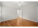 Bedroom featuring hardwood floors, neutral walls and door to hallway at 1000 Grimes Bridge Rd, Roswell, GA 30075