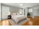 Charming bedroom with neutral walls, hardwood floors, and bright natural light at 1000 Grimes Bridge Rd, Roswell, GA 30075