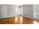 Bedroom with hardwood floors, bright natural light, and an ensuite bathroom at 1000 Grimes Bridge Rd, Roswell, GA 30075