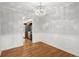 Charming dining area with hardwood floors and a view of an adjacent kitchen at 1000 Grimes Bridge Rd, Roswell, GA 30075