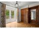 Light-filled dining area with built-in cabinets, hardwood floors, and access to the outdoor patio at 1000 Grimes Bridge Rd, Roswell, GA 30075