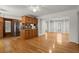 Open-concept dining and kitchen area featuring hardwood floors and stainless steel appliances at 1000 Grimes Bridge Rd, Roswell, GA 30075