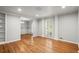 Spacious dining room with hardwood flooring, decorative chandelier, and wainscoting at 1000 Grimes Bridge Rd, Roswell, GA 30075