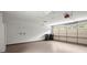 Clean garage with a white interior, a garage door with windows, and ample space at 1000 Grimes Bridge Rd, Roswell, GA 30075