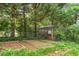 An organized vegetable garden includes multiple beds and a shed enclosed by a chain link fence at 1000 Grimes Bridge Rd, Roswell, GA 30075
