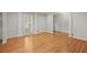 Bright and airy living room featuring hardwood flooring, fluted columns, and natural light at 1000 Grimes Bridge Rd, Roswell, GA 30075