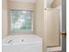 Bathroom featuring a soaking tub and a separate shower stall with a glass door at 15 Ashton Pl, Covington, GA 30016