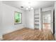 Dining room with built-in shelving, natural light, and hardwood floors at 15 Ashton Pl, Covington, GA 30016