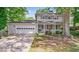 Attractive home with a two-car garage, and covered front porch enhanced by mature trees and landscaping at 15 Ashton Pl, Covington, GA 30016