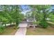 Well-maintained home featuring mature landscaping, a long driveway, and a welcoming front porch at 15 Ashton Pl, Covington, GA 30016