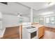 Bright kitchen featuring granite countertops and a breakfast bar overlooking the living area at 15 Ashton Pl, Covington, GA 30016