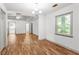 Inviting living room with hardwood floors, natural light, and modern ceiling fan at 15 Ashton Pl, Covington, GA 30016