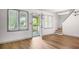 Bright living room features hardwood floors, ample natural light, and easy access to the front porch through a glass door at 15 Ashton Pl, Covington, GA 30016