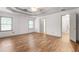 Spacious main bedroom with hardwood floors, tray ceiling and ensuite bath at 15 Ashton Pl, Covington, GA 30016