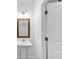 Bathroom with mirror and vanity, next to a white door at 191 Davis Ct, Hiram, GA 30141