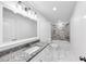 Bathroom featuring granite counters, marble floors and tiled walls at 191 Davis Ct, Hiram, GA 30141