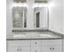 This bathroom features double sinks, granite counters, and tiled shower/tub combos at 191 Davis Ct, Hiram, GA 30141