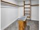 The closet is carpeted and has wooden shelving and a center island at 191 Davis Ct, Hiram, GA 30141