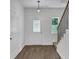 Inviting foyer showcasing hardwood floors, staircase, and decorative glass front door, creating a warm welcome at 191 Davis Ct, Hiram, GA 30141