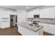 Modern kitchen boasts granite countertops, stainless steel appliances, and ample cabinet space for culinary enthusiasts at 191 Davis Ct, Hiram, GA 30141