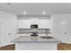 Modern kitchen boasts granite countertops, stainless steel appliances, and ample cabinet space for culinary enthusiasts at 191 Davis Ct, Hiram, GA 30141