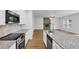Open kitchen view with stainless steel appliances and granite countertops at 191 Davis Ct, Hiram, GA 30141