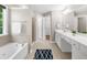 Bathroom with garden tub, walk-in shower, double vanity, and neutral colors at 220 Finchley Dr, Roswell, GA 30076