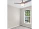 Neutral bedroom with a ceiling fan and a large window providing lots of light at 220 Finchley Dr, Roswell, GA 30076