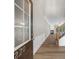 Bright entryway featuring sleek floors, wainscoting and a staircase at 220 Finchley Dr, Roswell, GA 30076