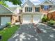 Inviting townhome with a well-manicured lawn and a two-car garage at 220 Finchley Dr, Roswell, GA 30076